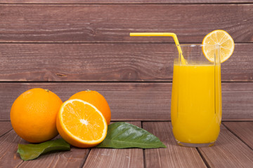 orange juice glass on wood background