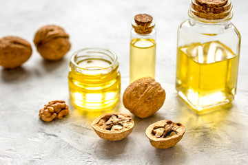 cosmetic and therapeutic walnut oil on gray background