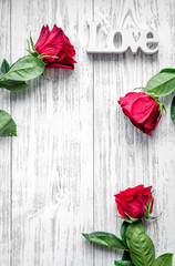 concept Valentine's Day with flower wooden background top view