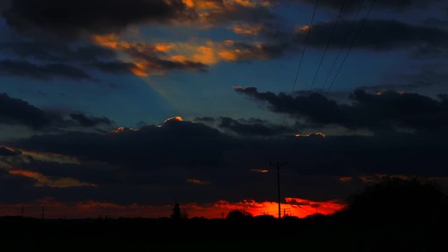 Time lapse video Sunset through clouds