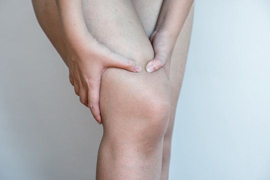 Woman Holding Injured Knee Suffering Pain Injury Pulled Muscle