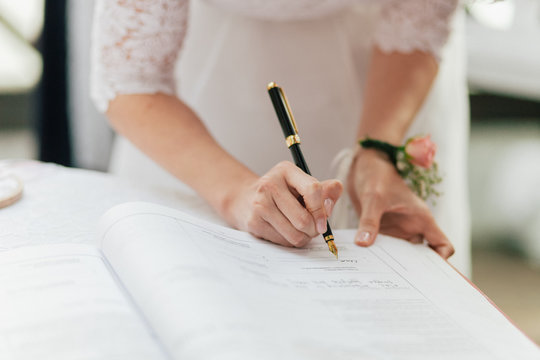 Bride Signing Marriage License