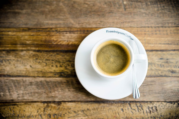 white coffee cup on wooden table