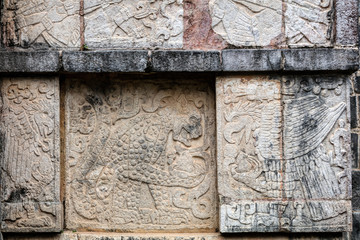 Ancient Mayan murals depicting jaguars and eagles grasping human hearts on the Platform of the Eagles and the Jaguars at Chichen Itza, Yucatan, Mexico
