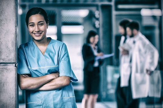 Smiling nurse standing in hospital