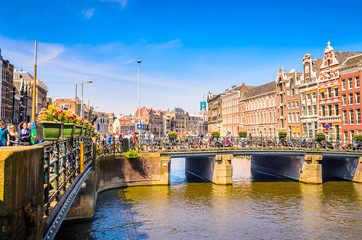 Traditional old buildings and and boats in Amsterdam, Netherland