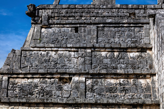 Ancient Mayan carving on the facade of the Osario pyramid in the Chichen Itza archaeological area in Yucatan, Mexico.
