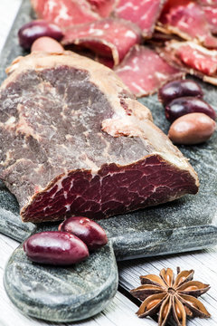 Sliced homemade smoked beef. Suho meso. Dried meat. Cured meat.