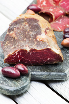 Sliced homemade smoked beef. Suho meso. Dried meat. Cured meat.