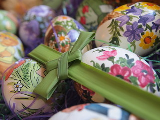 Hand painted Easter eggs and palm leaf