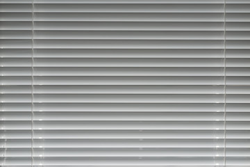 White venetian blinds. Selective focus.