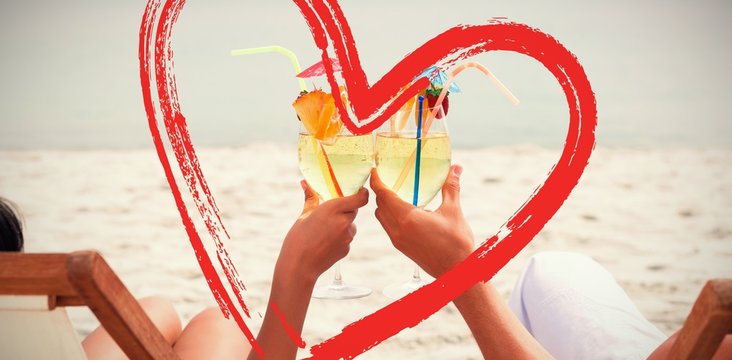 Composite Image Of Couple Clinking Glasses Of Cocktail On Beach