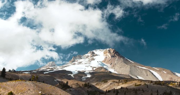 Whispy White Clouds Casting Shadows over a Snow-capped Mountain Peak, Mt Hood, Oregon