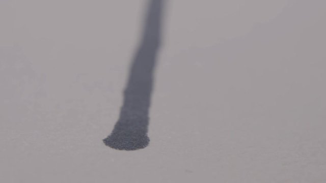 Artist Drawing with Black Marker or Sharpie, on White Paper, Close Up