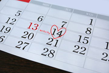 Calendar page with a red hand written heart highlight and text "Valentine's Day" on February 14 of Saint Valentines day.