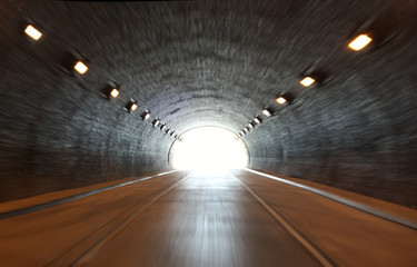 defocused photo on light at the end of tunnel - obrazy, fototapety, plakaty