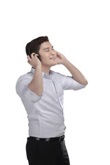 Young asian man listening music with headphone
