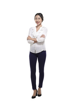 Portrait of a happy asian business woman standing with folded hands