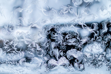 Frozen window where the ice looks like feathers