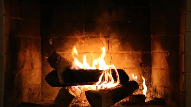 Burning fire In the fireplace. Wood and embers in the fireplace