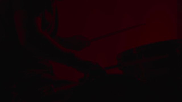Drummer Drumming in Slow Motion with Strobe Light