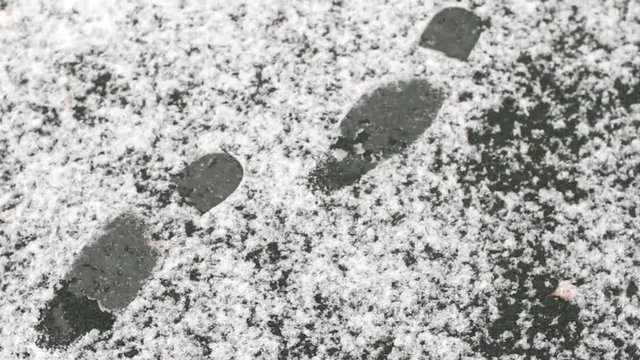 Men's Footprints on Snow-Covered Track
