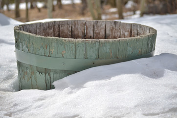 Old barrel in snow
