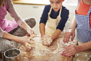 Close up of dirty hands making pastry