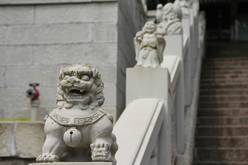Chinese stone lion at the stairs of Guangde temple