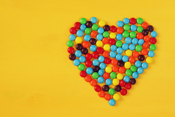 Top view party table with heart shape candies