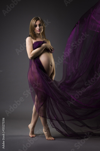 Beautiful Naked Pregnant Ladies - Beautiful naked pregnant woman with purple silk on gray ...