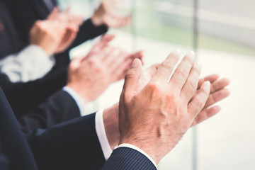 Business people clapping their hands