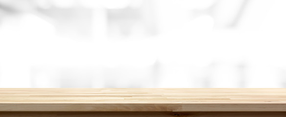 Wood table top on abstract blur white background