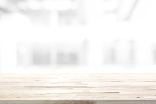 Wood table top on abstract blur white background