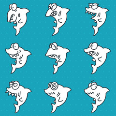 Naklejka premium Set of funny doodle sharks