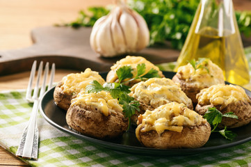 Baked mushroom caps stuffed with creams cheese, garlic and herbs.