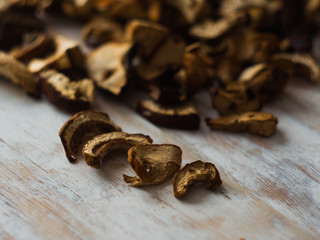 Dried Mushrooms on wooden background selective focus