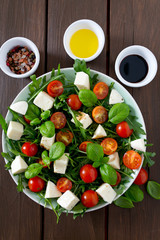 Vegetarian salad with cherry tomato, mozzarella and rucola