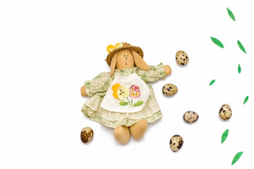quail eggs, Easter Bunny, willow branches on white background.