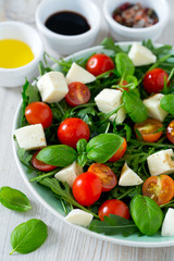 Vegetarian salad with cherry tomato, mozzarella and rucola