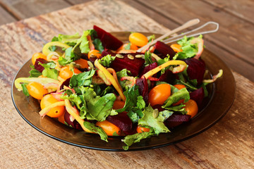 Baked beetroot arugula yellow cherry salad