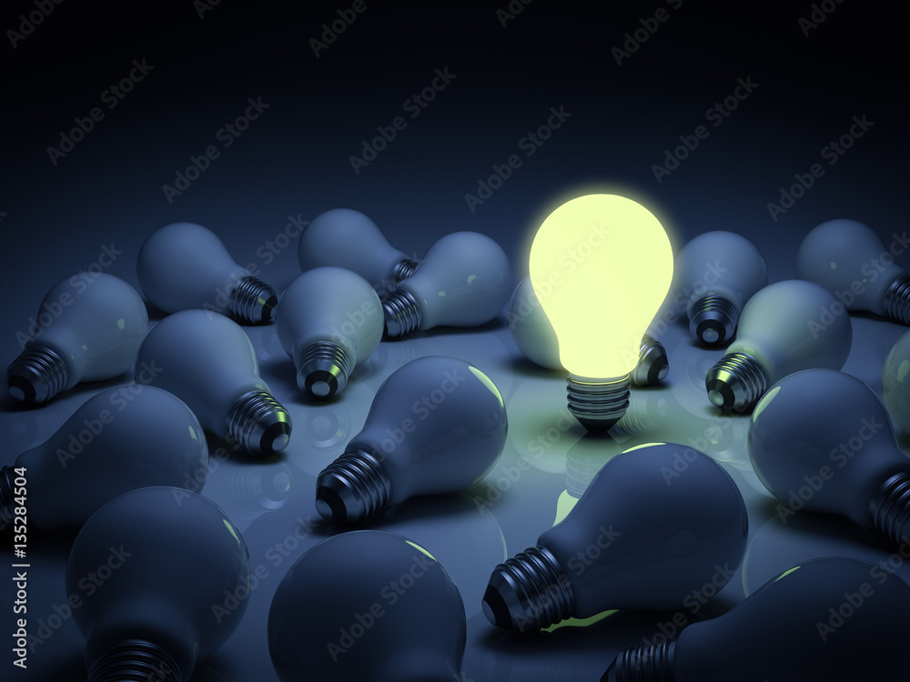 Leinwandbilder one lit glowing light bulb standing out from the unlit incandescent bulbs with reflection , individu