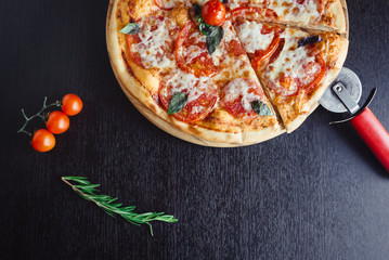 Italian Pizza on the Board in the dark table