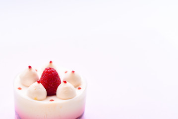 Delicious cake with raspberries on a white background