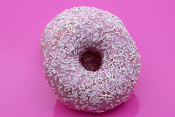 candy donuts isolated on a pink background