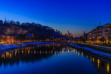 Panoramic night view of Salzburg and river Salzach, Salzburger L
