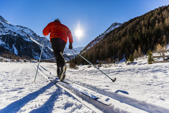 Cross-country skiing on the trail in cold sunny winter day in So