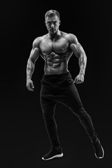 Fototapeta na wymiar Shirtless male model posing muscular core