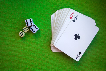 cards and dice on green background