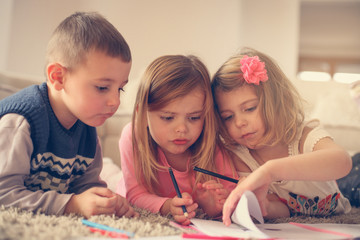 Fototapeta premium Children lying on the floor.
